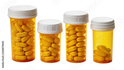 Foto Four amber prescription bottles filled with yellow oval pills