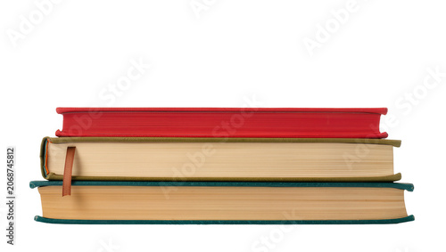 Konstfotografi Stack of three hardcover books red beige, and tan with green spine