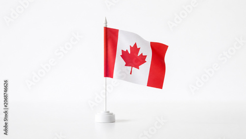 Miniature Canadian flag in simple white base with copy space