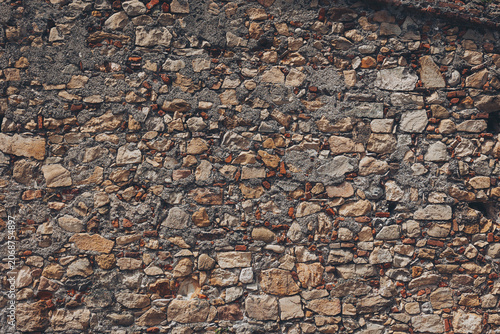 Texture of ancient stones tells a story of time, resilience, and artistry in a beautiful wall that has stood the test of time