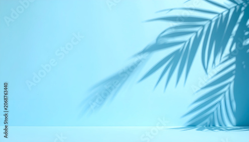 Minimalist Blue Background with Palm Leaf Shadows and Soft Light.