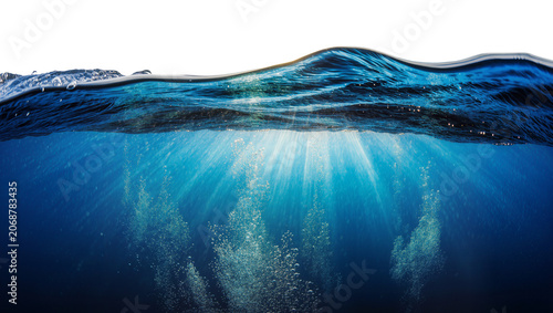 Fotografía Underwater scene with sun rays piercing the surface creating light beams and bub