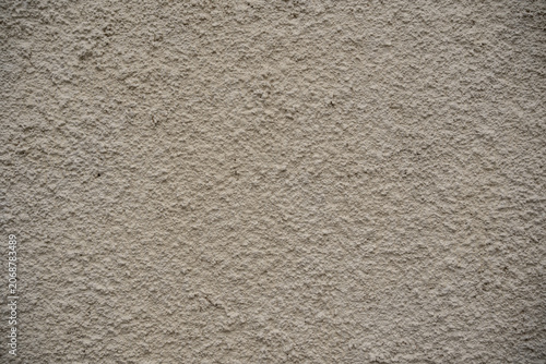 Foto Light beige rough stucco wall texture