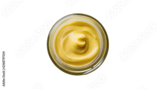 Obraz na plátne Glass jar with yellow mustard sauce swirl