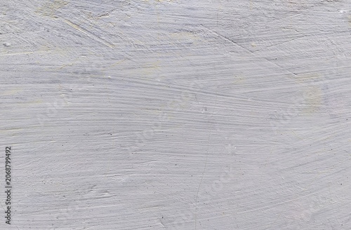 ​Abstract textured grey painted wall background with visible brush strokes