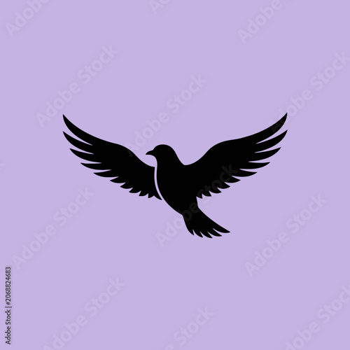 A black silhouette of a bird flying on purple background