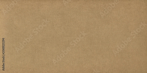 Brown kraft paper sheet - seamless background texture. Recycled cardboard carton packaging banner.