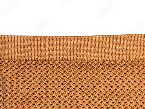 Quadro su tela Close-up image of a knitted fabric featuring a ribbed orange and beige pattern with intricate textured stitches