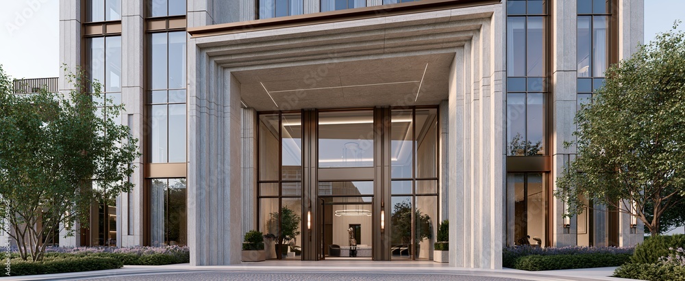 Naklejka premium Modern luxury is showcased in this sleek building featuring stone walls, bronze details, large glass windows, and impressive columns.