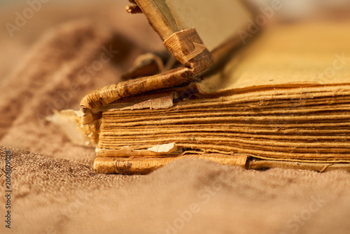 Old pages bring back warm memories. Weathered pages of antique book evoke heartfelt nostalgia and soothing atmosphere