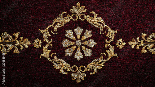 Seamless golden floral mandala pattern on a deep red background.