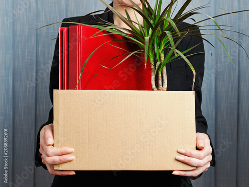 Businesswoman clearing her desk