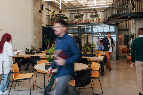 Business people collaborating in modern coworking office space