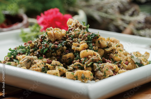 Sichuan pepper, mint and taro served on a square celadon plate