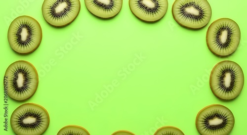Kiwi Slices Border on Green Background - Healthy Food & Fruit Concept