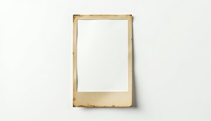 Empty vintage frame on white background. Beige aged cardstock border with burnt edges. Retro instant photo template for memories, designs, or notes.