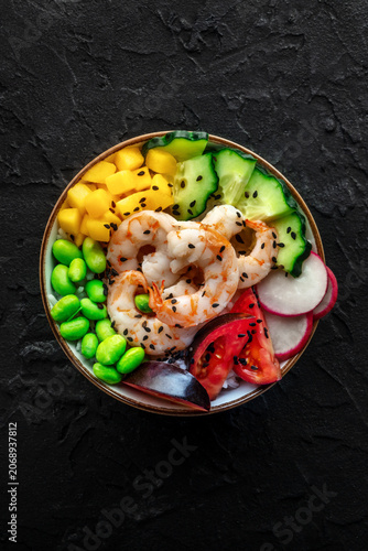 Poke bowl with shrimps, tomatoes, cucumber, mango, edamame