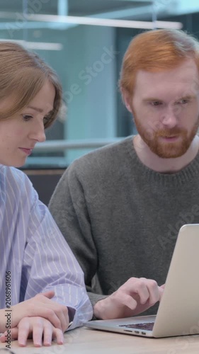 Young Man and Woman Working on Laptop, Vertical Video