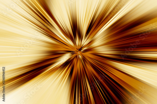 Abstract radial zoom blur in gold, brown and cream tones, creating dynamic glowing light streaks radiating from the center with strong motion and depth.