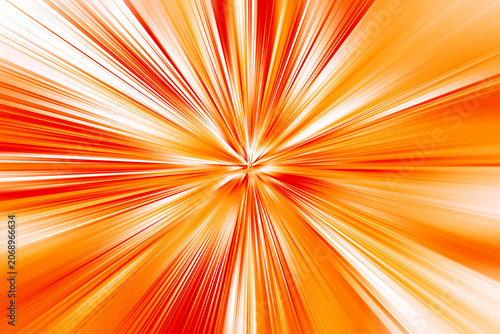 Abstract radial zoom blur in orange, red and white tones, forming a vivid burst of light with energetic radiating streaks and a strong sense of motion.