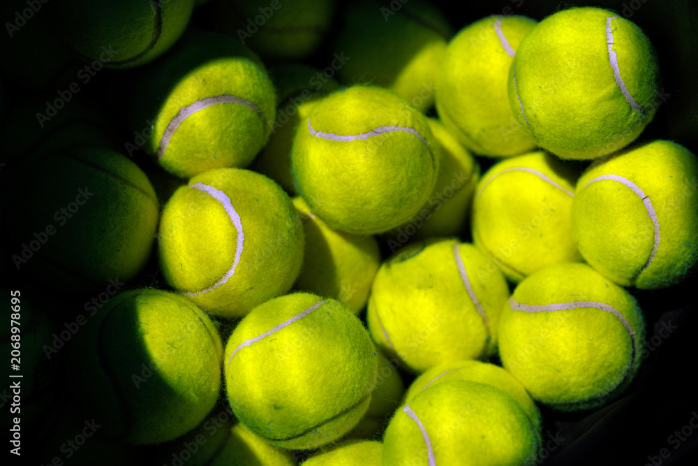 Obraz premium Full frame texture background of bright yellow tennis balls