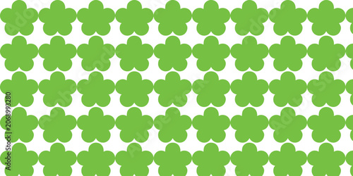 Abstract geometric seamless pattern with simple green flower shapes on white background.