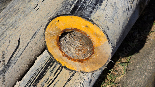 Photos Cross section of old preinsulated district heating pipe with clogged interior