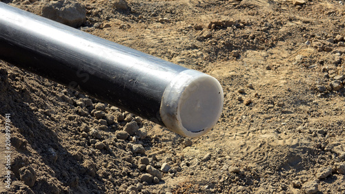 Tableau sur toile High-density polyethylene utility pipe with protective white plastic end cap on