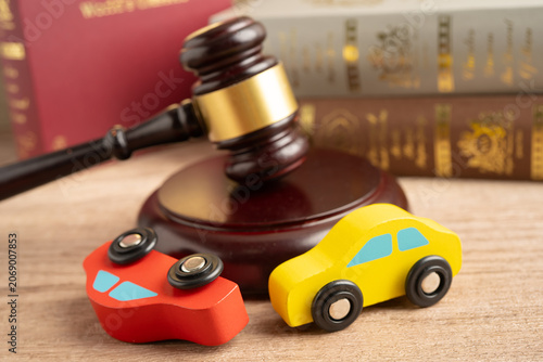 Fotografía Car accident lawsuit and insurance, Judge hammer with car model.