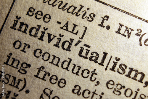 Photos Word individualism on dictionary page, macro close up