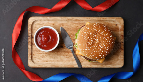 Cheeseburger with Ketchup on Wooden Board: Independence Day Snack