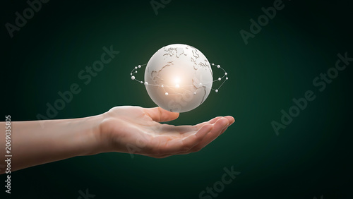 Human Hand Cupping Floating Earth Globe with Glowing Network Communication Rings for Global Business Logistics and Worldwide Connection Concept