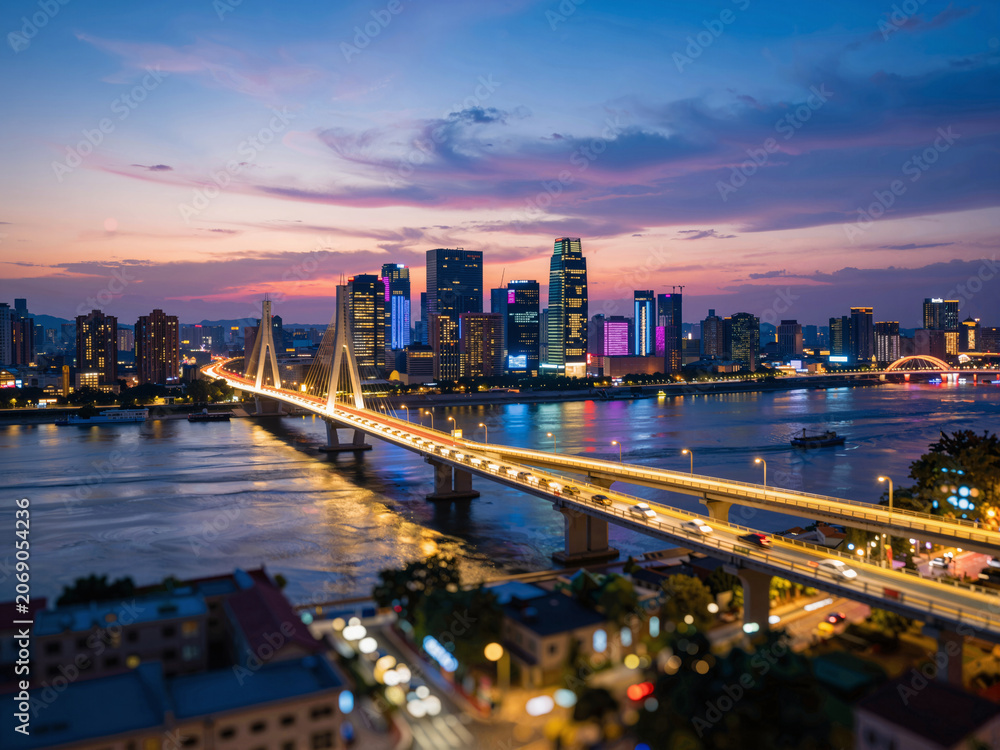 Obraz premium City skyline with river bridge at dusk night view