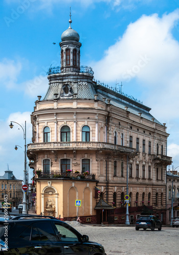 Building with a distinctive tower in Chernivtsi, Ukraine, seen on a clear day with blue skies and light clouds