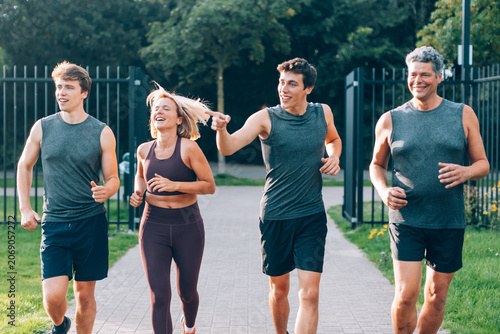 Εκτύπωση καμβά Family group enjoying a happy jog on a park pathway