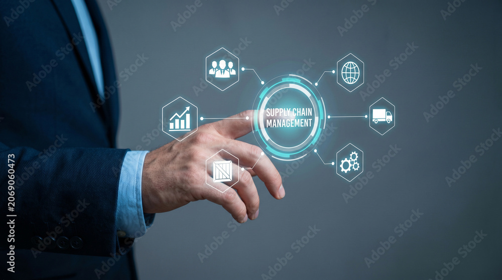 Fototapeta premium Professional businessman touching a digital supply chain management interface with glowing icons on gray background