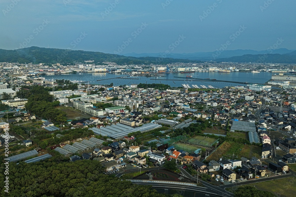Fototapeta premium Aerial drone photo of Miho no Matsubara coastline and port town, Shizuoka, Japan