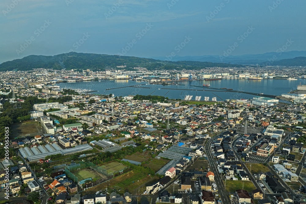 Fototapeta premium Aerial drone photo of Miho no Matsubara coastline and port town, Shizuoka, Japan