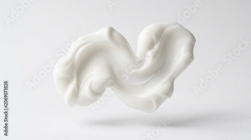 White cosmetic cream swirl levitating on light background, smooth beauty lotion smear.