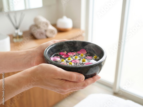 Relaxing Spa Scene with Flowerdecorated Water Bowl