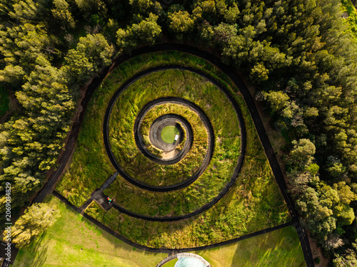 фотографія Aerial view of spiral green hill top.