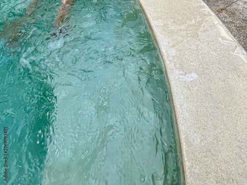 Foto Clear Turquoise Water Rippling Gently Near the Concrete Edge of a Swimming Pool