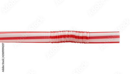 Foto Isolated red and white striped flexible plastic drinking straw for beverages and