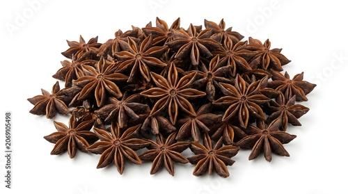 A pile of star anise spice on a white background