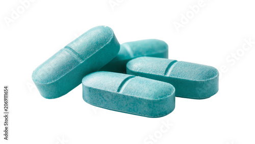Cuadro en lienzo Isolated several light blue oblong pills with scored lines, pharmaceutical medic