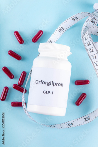Orforglipron, non-peptide GLP-1 receptor agonist, oral pills for weight loss, weight control,  Insulin resistance, diabetes, slimming healthy eating concept. Capsules with hormones in one day doses