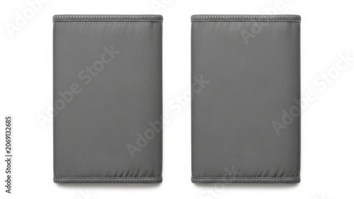 Two gray fabric squares with a textured surface and a serrated edge on a white background