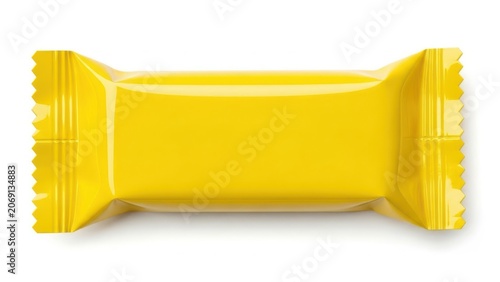 A bright yellow candy bar wrapper with a glossy finish and perforated edges