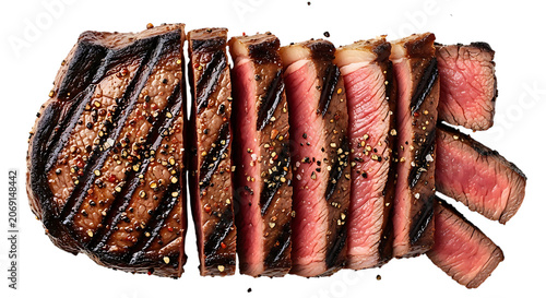 Sliced grilled steak, medium rare, with grill marks and seasoning, on black background, sliced steak