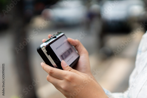 Hand holding a walkman. A device for listening to old music stored on cassettes.